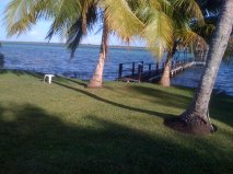 The lawn slopping down to the laguna.