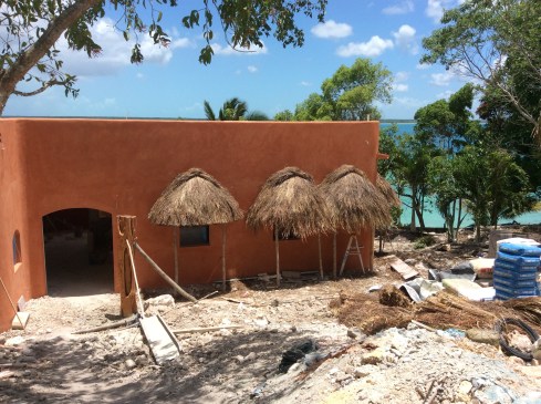The palm frond overhangs protect from sun and rain. They will be completed is week.