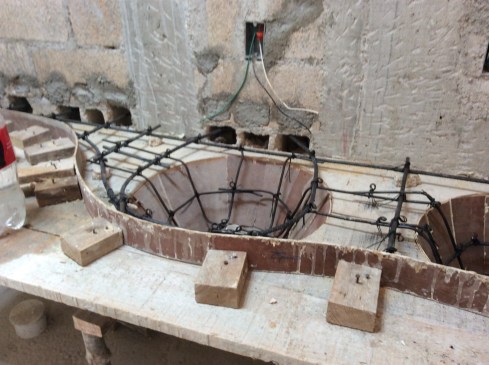 Creating the mold for a poured concrete bathroom sink. 